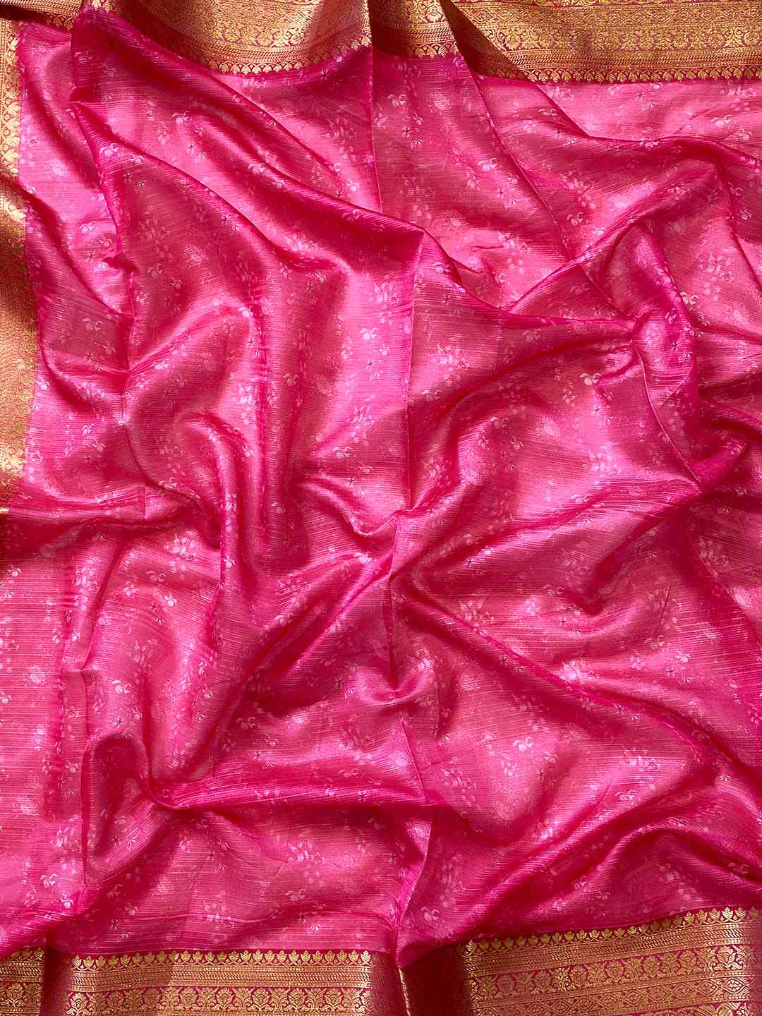 Close-up of pink and gold fabric from Kota silk saree