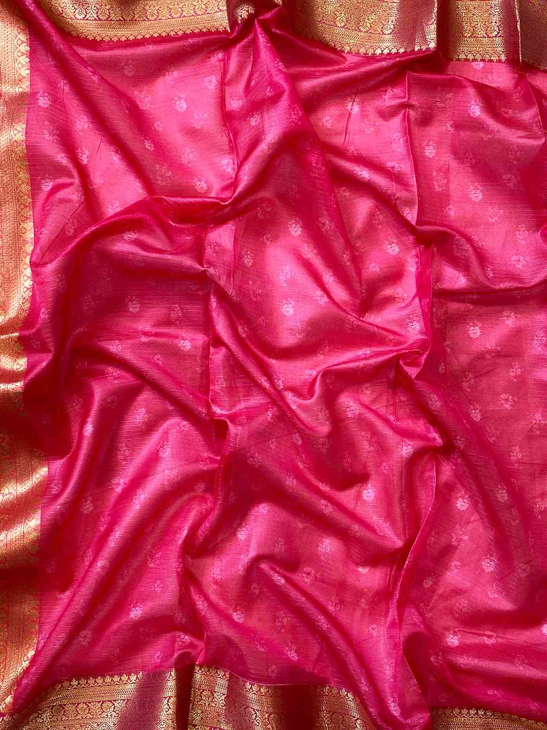 Close-up of pink and gold border on Kota silk saree