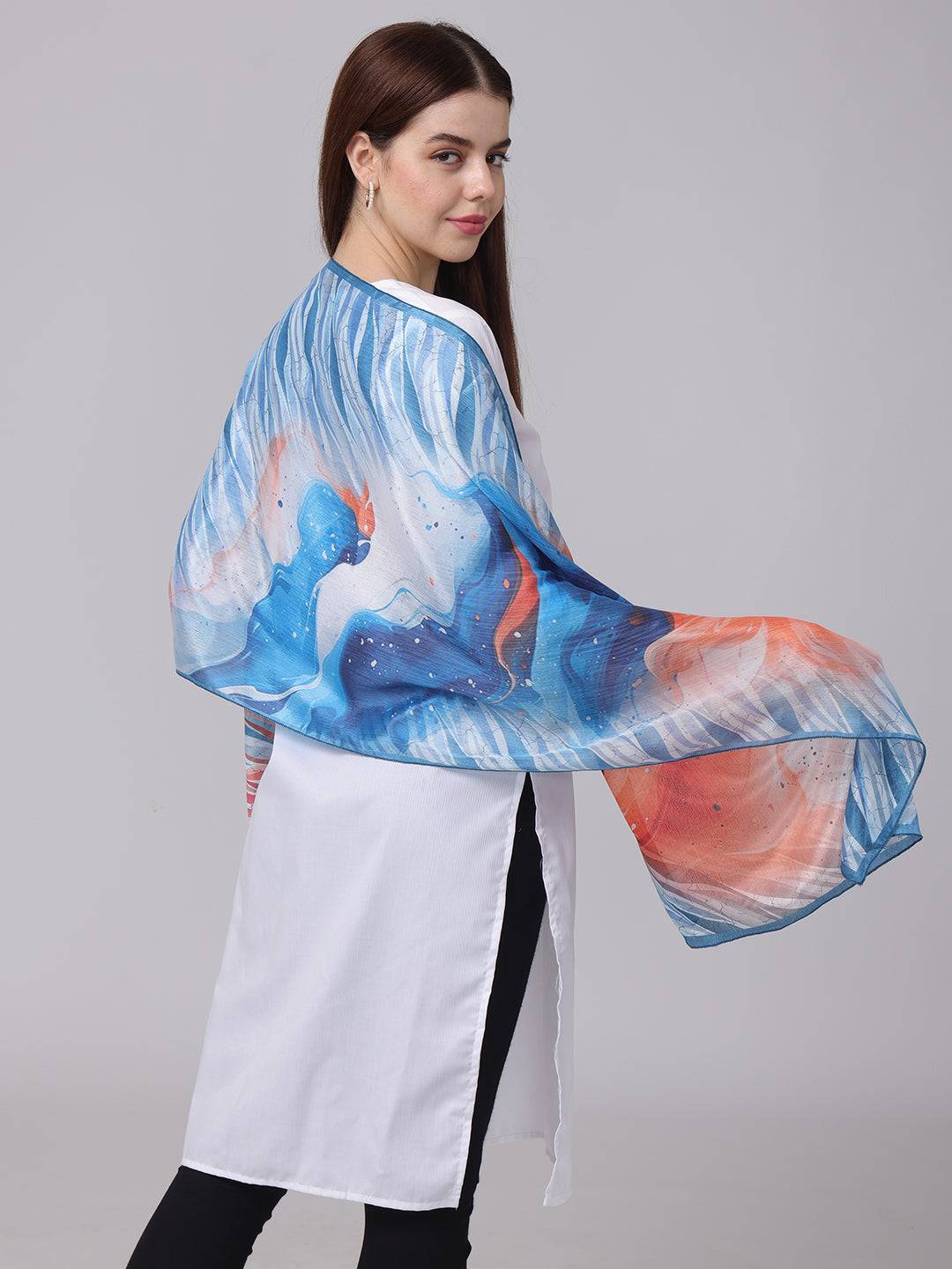 Elegant vibrant abstract patterned scarf draped over shoulders