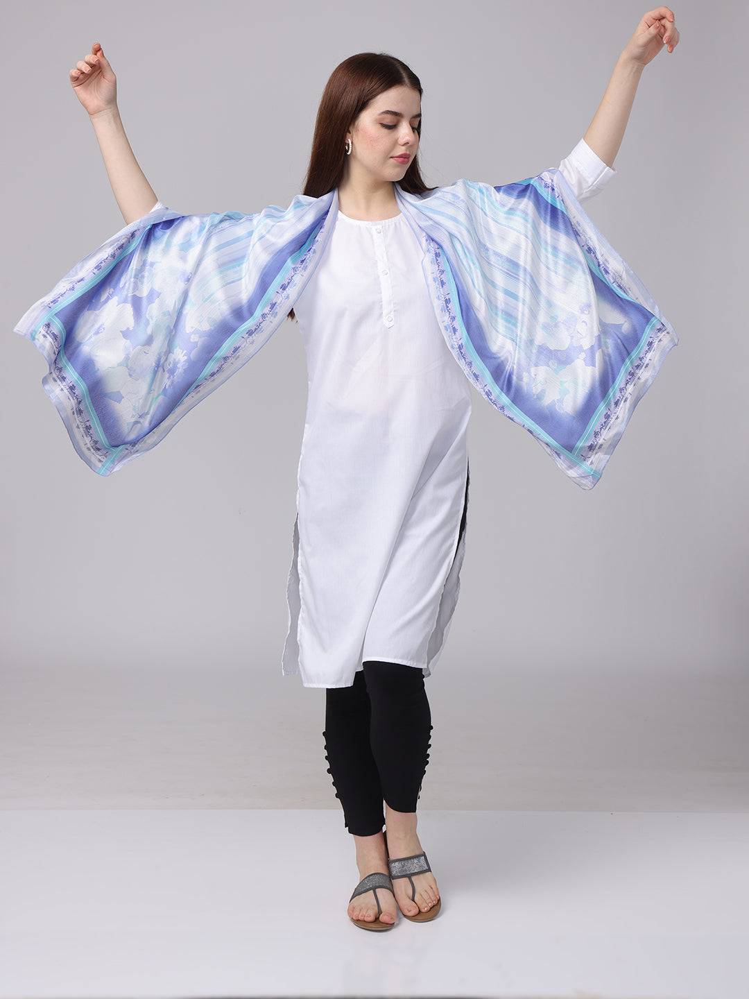 Model showcasing serene blue floral scarf spread out