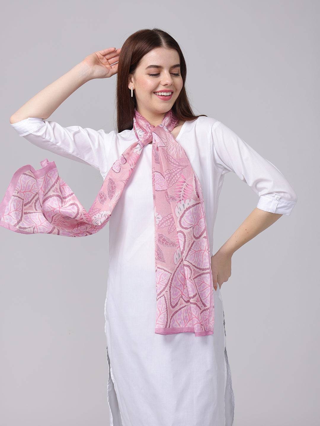 Charming pink leaf pattern scarf draped on model.