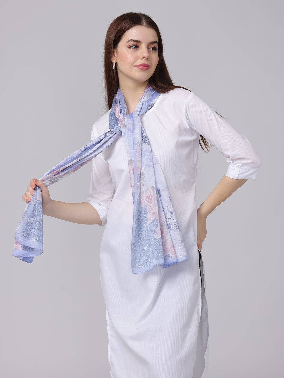 Model wearing ethnic motifs patterned scarf in blue, pink, gray