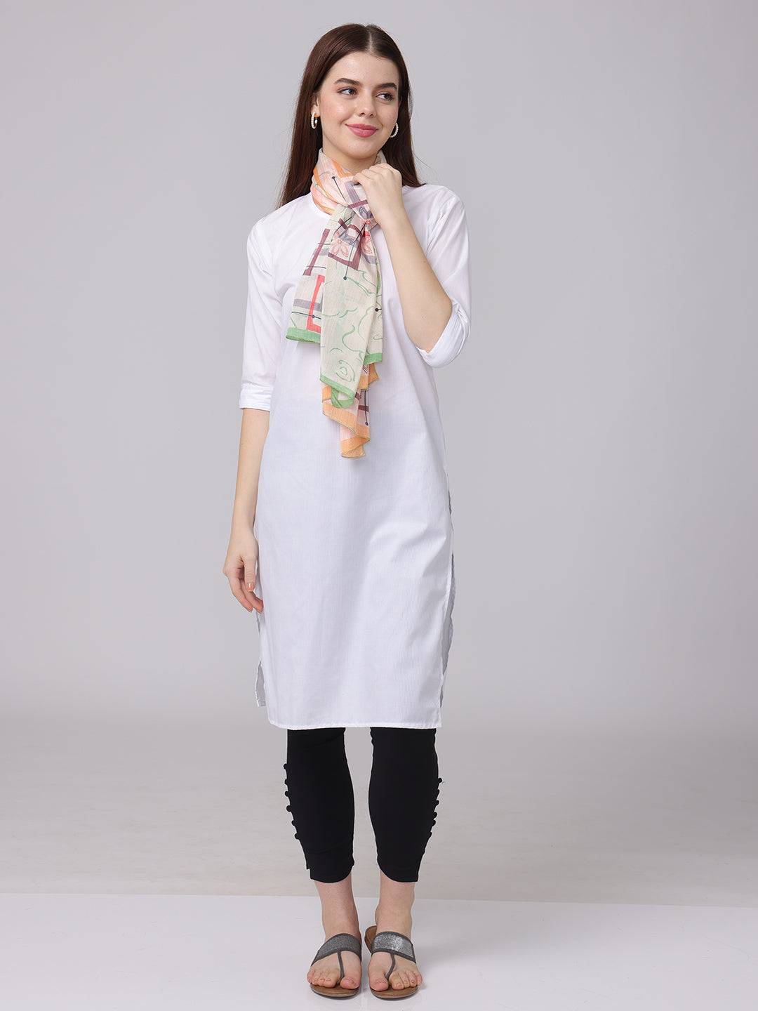 Floral geometric pastel scarf tied around neck with white dress.