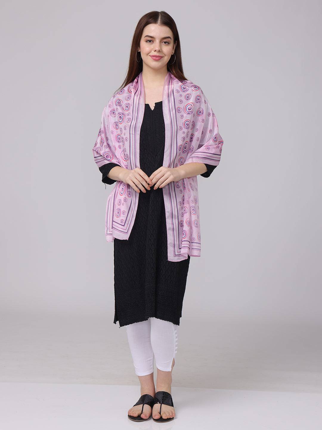 Front view of vibrant circular printed scarf draped over shoulders.