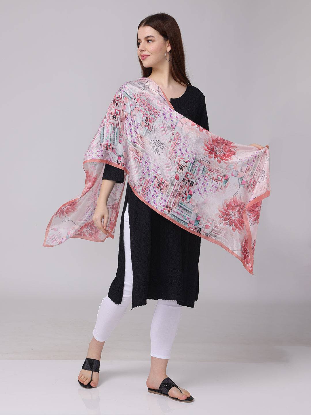 Floral and geometric print scarf draped over shoulder
