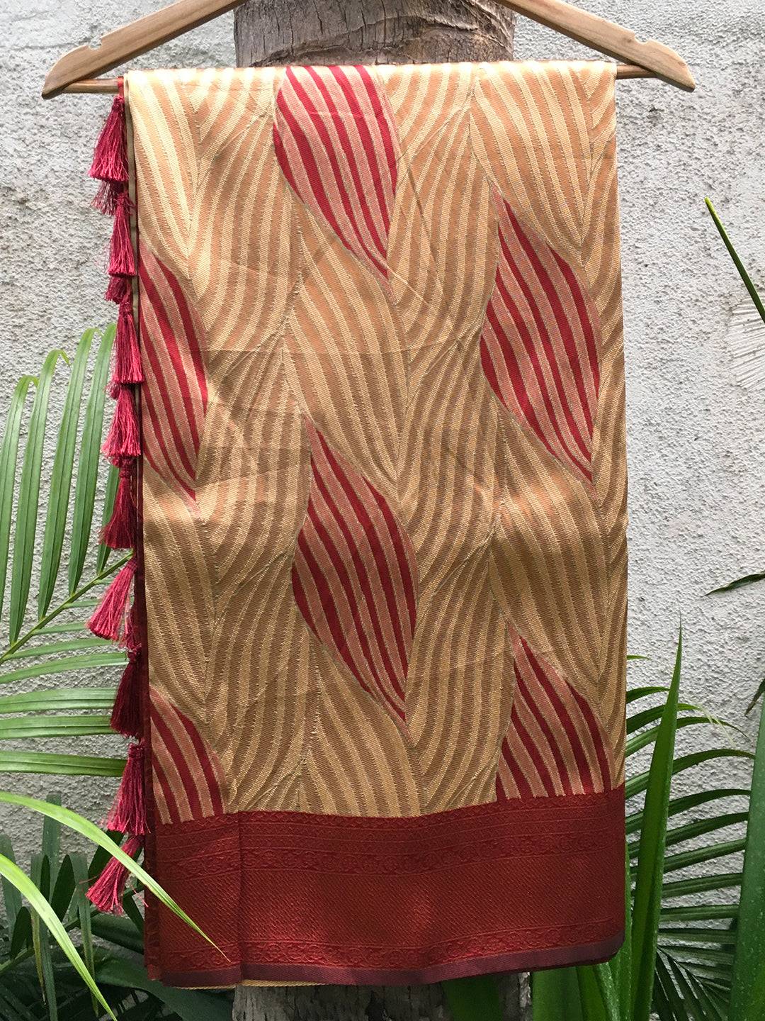 Tan Brown Ikkat Saree Draped on Hanger