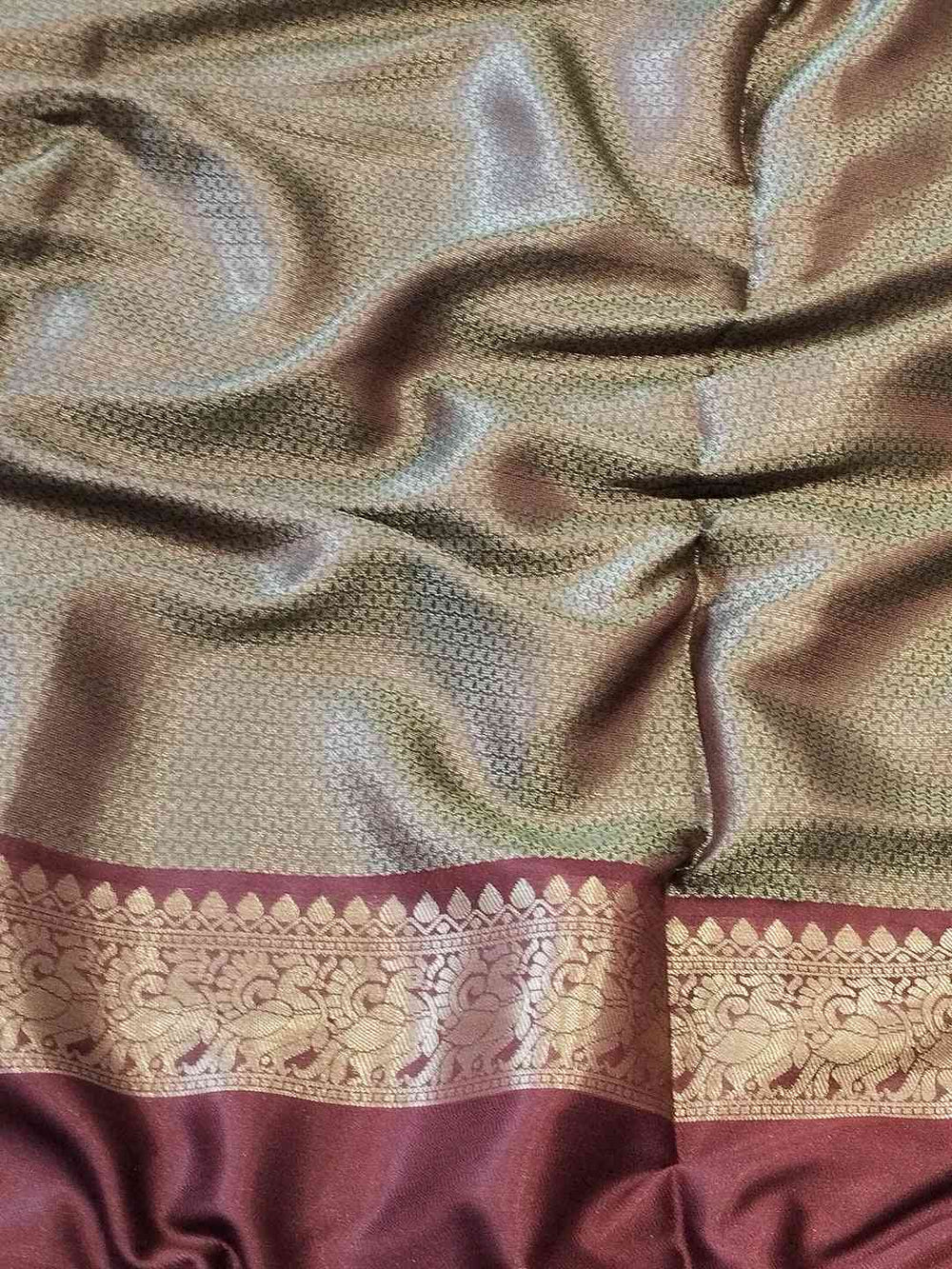 Fabric detail of light green Banarasi saree with double border
