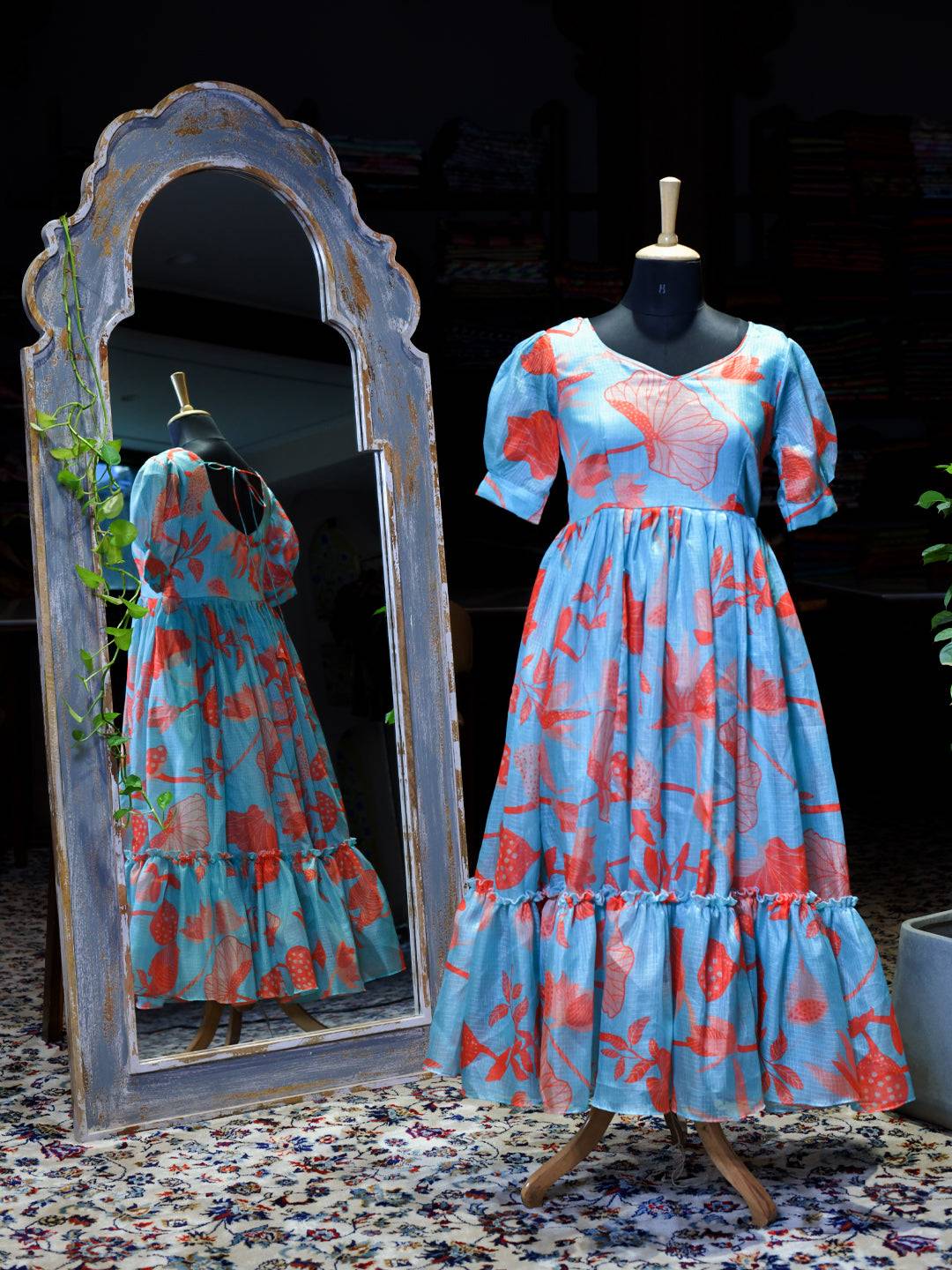 Sea Blue Floral Print Dress on mannequin