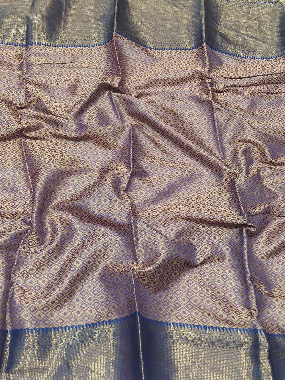 Detailed view of Banarasi saree fabric with Minakari Ikkat