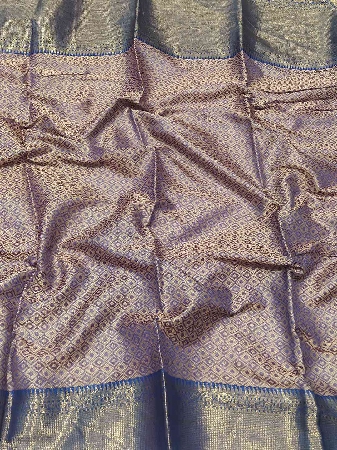Detailed view of Banarasi saree fabric with Minakari Ikkat