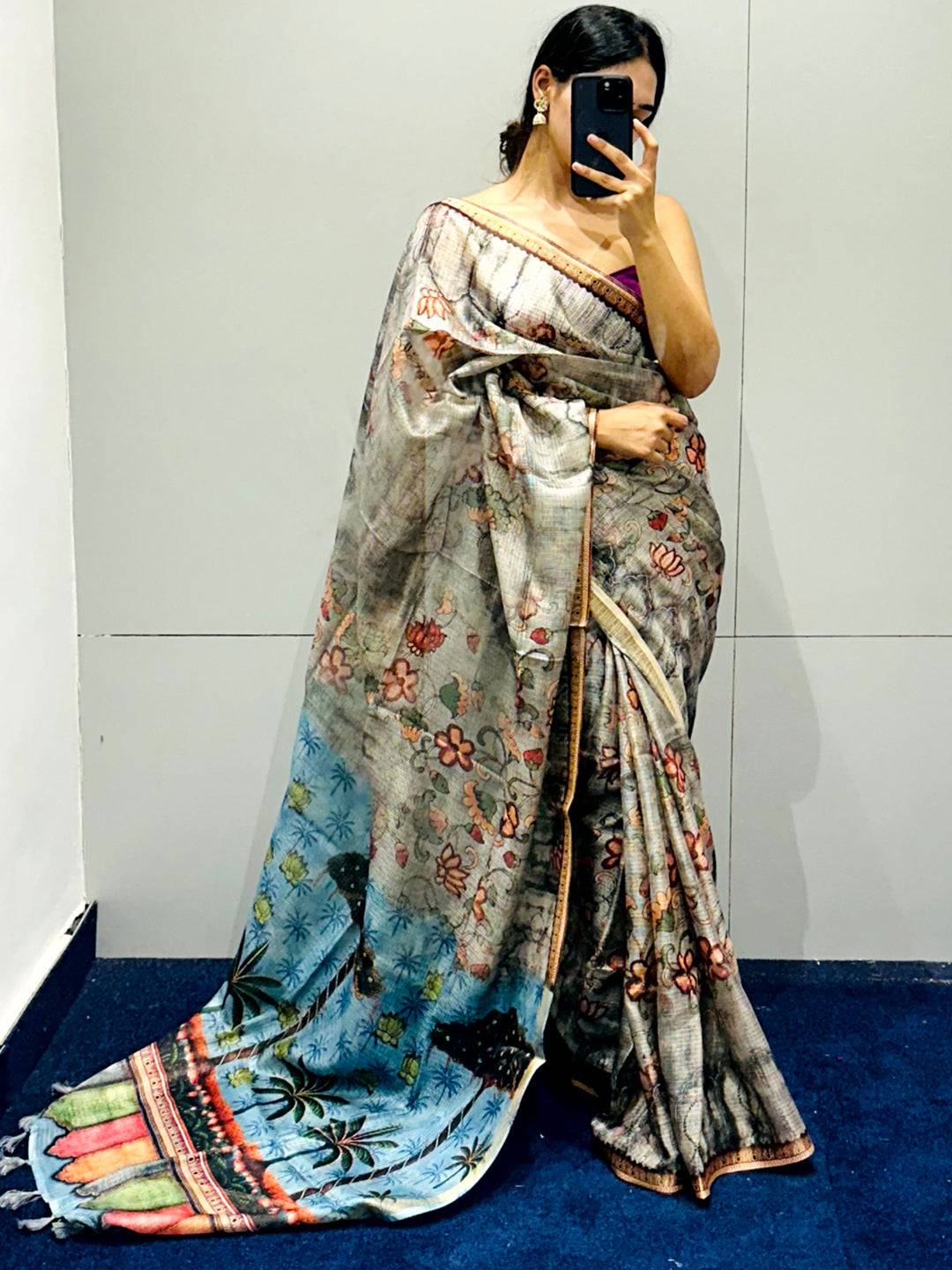 Woman posing in grey Kota Doriya silk saree with floral motifs