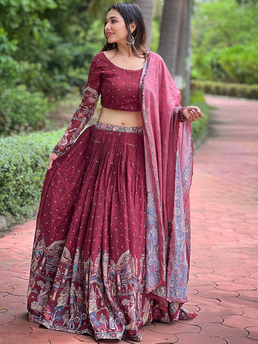 Deep maroon Kalamkari lehenga with dupatta outdoors