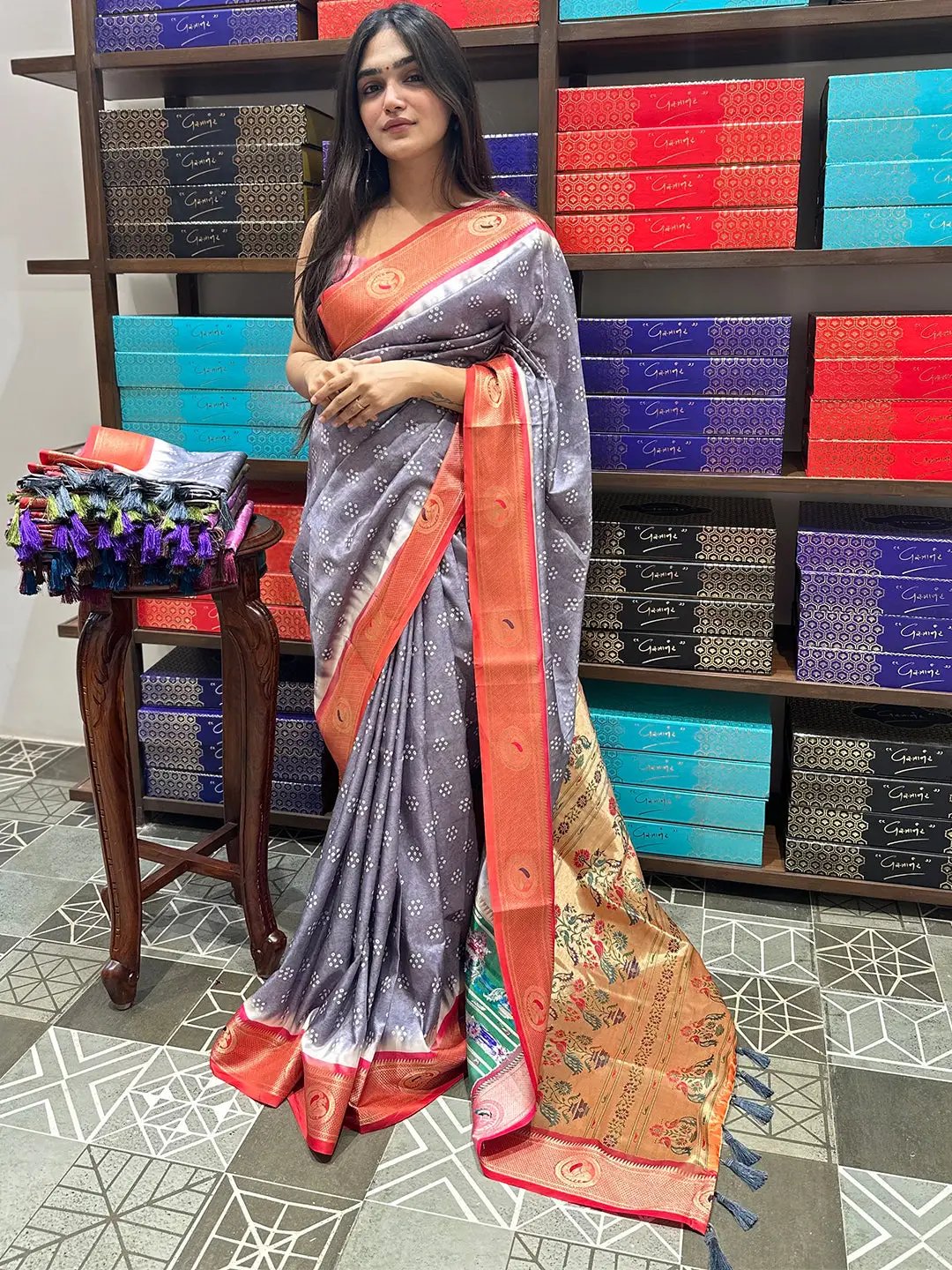Model showcasing silk saree with intricate Minakari Pallu design