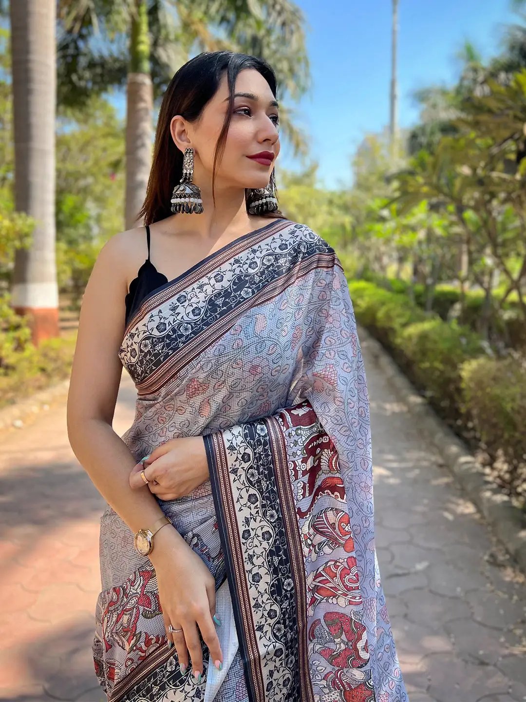 Model wearing Lavender Satin Kota Doria Saree