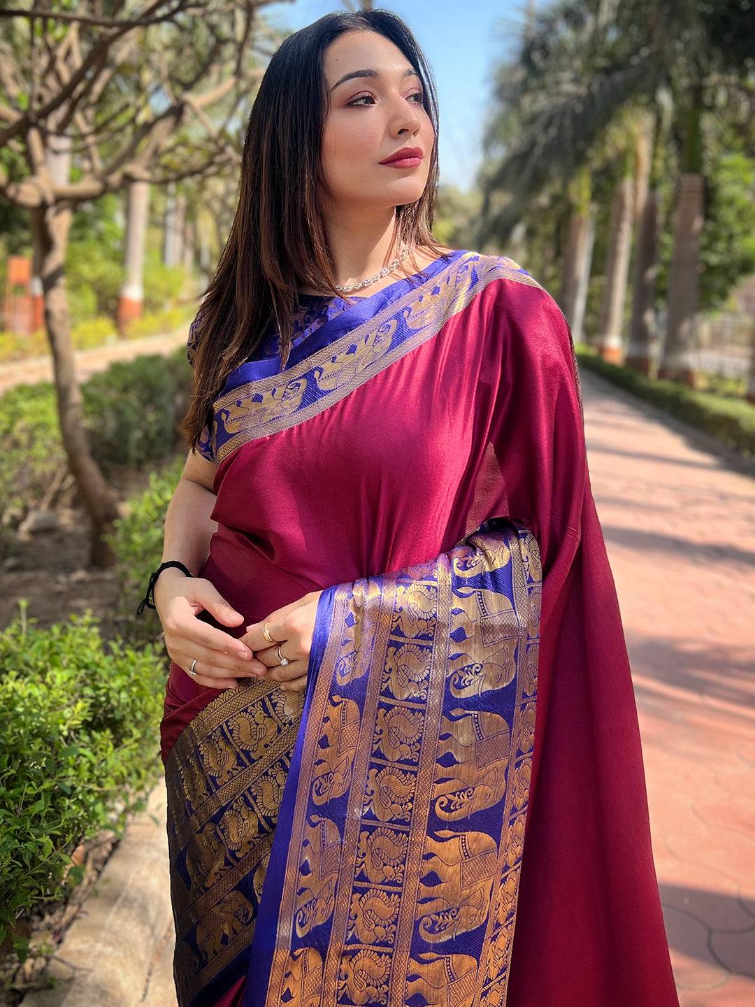 Maroon Kanjivaram saree with intricate gold border