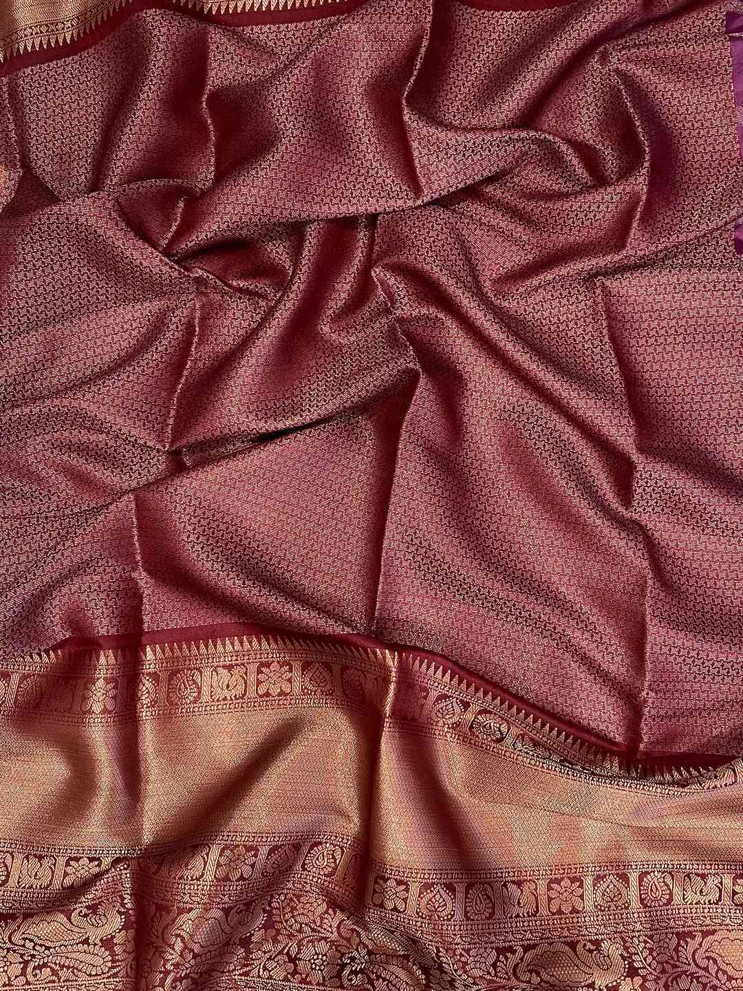 Close-up of soft silk Bandhej saree fabric with digital print