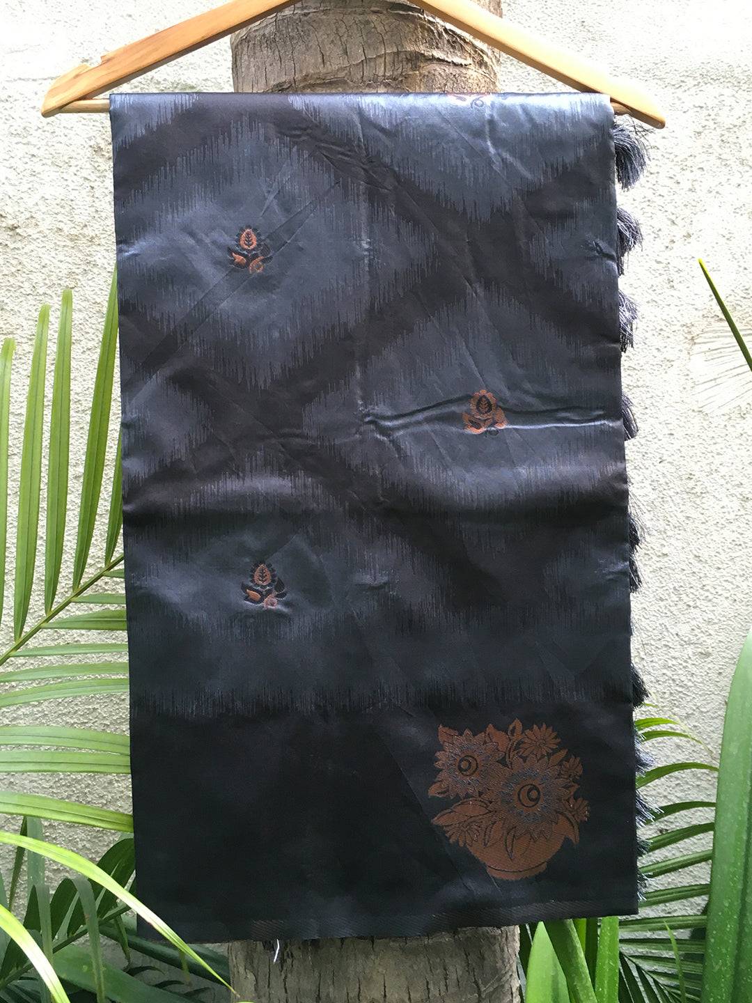 Black Tussar Silk Ikkat Weaving Saree on hanger