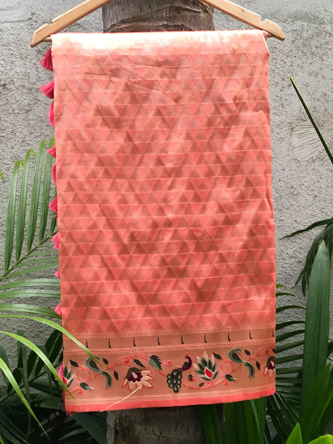 Peach silk blend saree with woven floral zari work on hanger