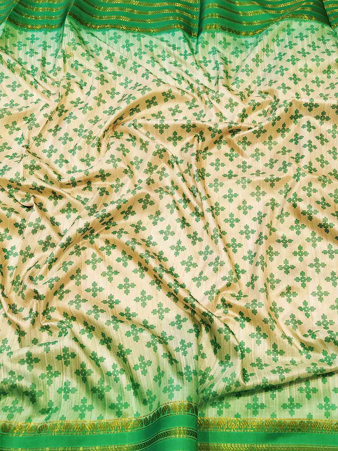Close-up of Ghicha saree with green Ikkat motifs and paisley prints
