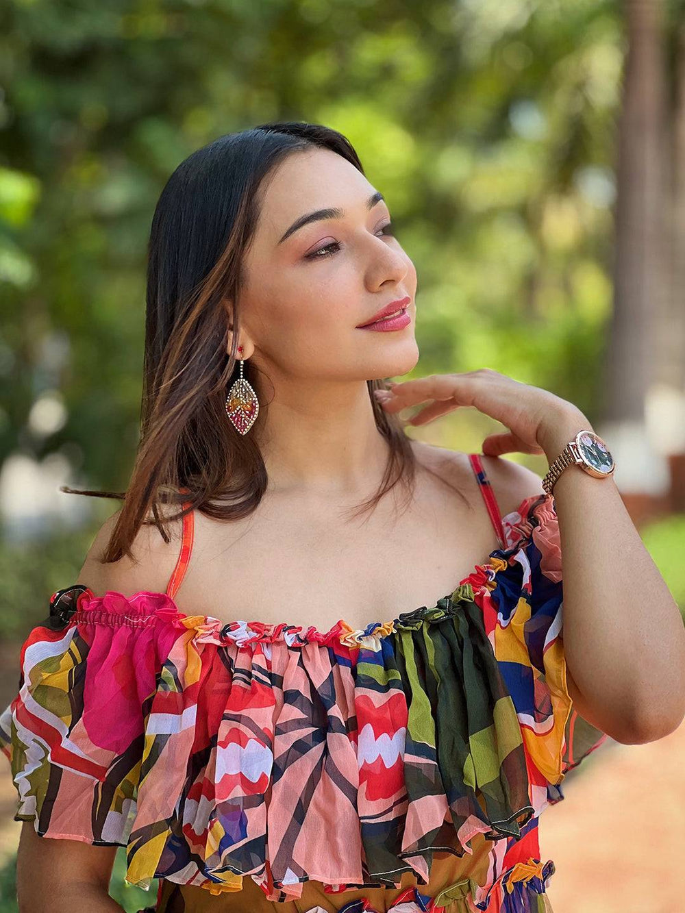 Close-up of woman in vibrant off-shoulder dress