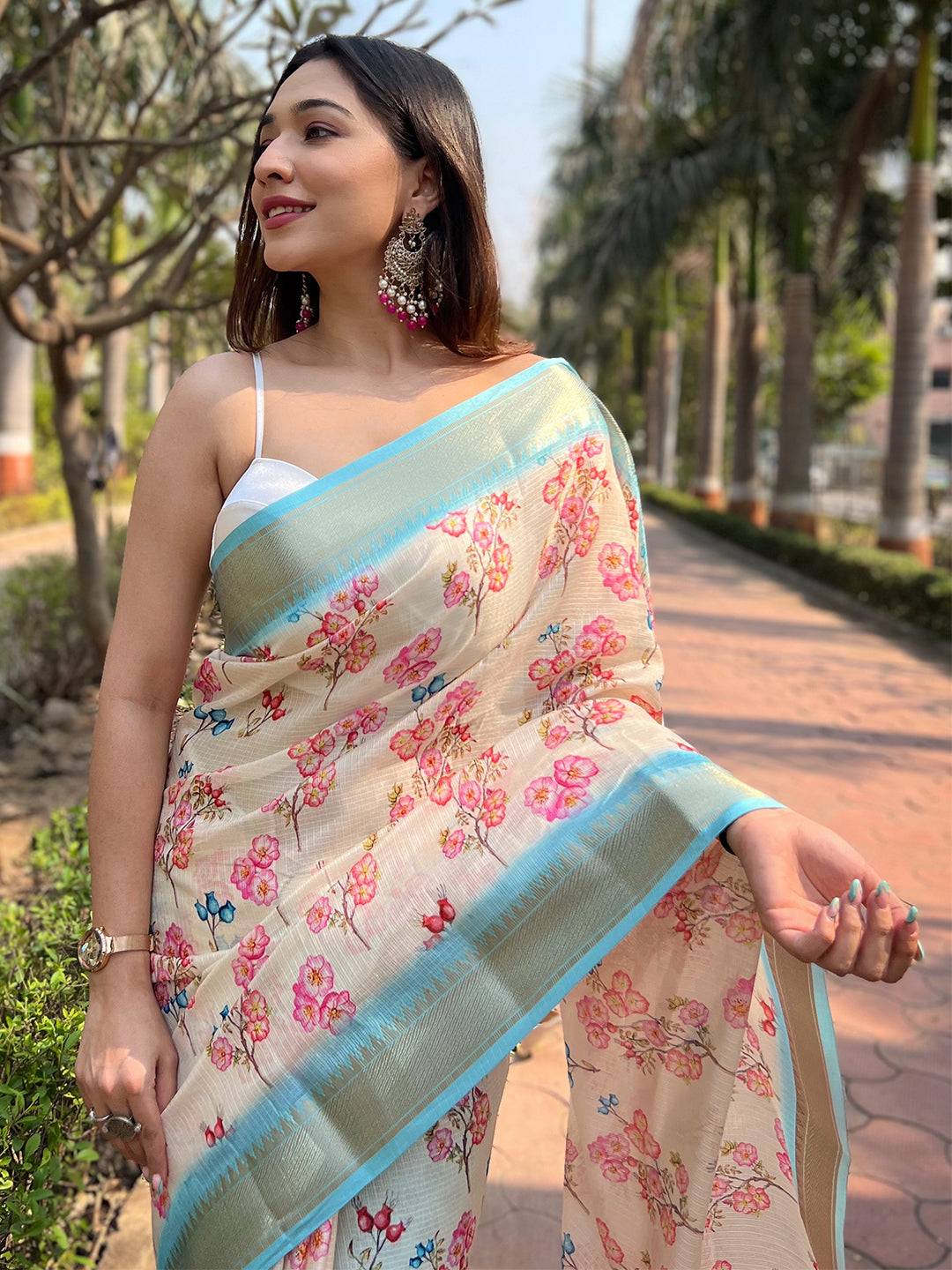 Close-up of Cream Kota saree with vibrant floral print