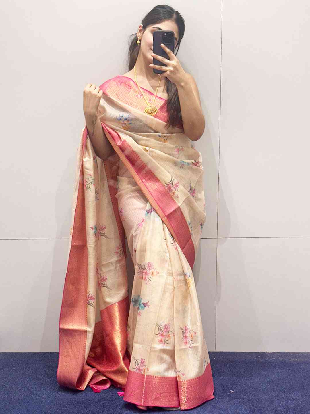 Peach Kota silk saree with floral print and pink border details