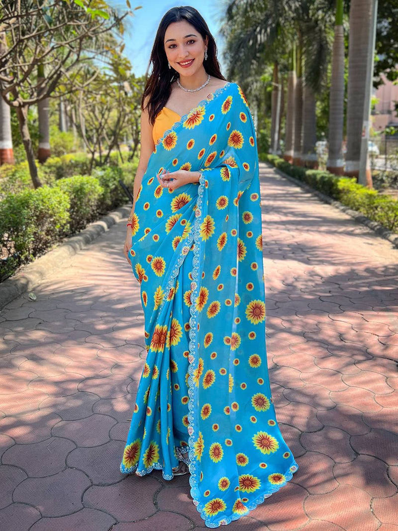 Model wearing blue sunflower print saree with Swarovski border