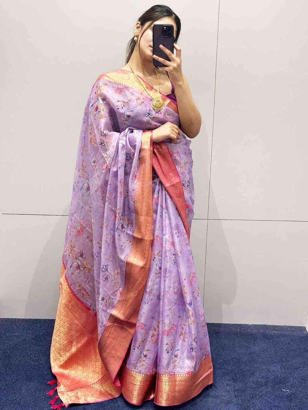 Purple floral print saree with gold border, elegant design