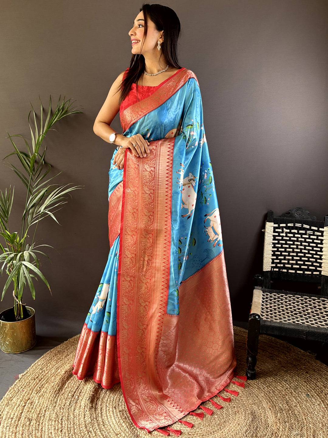 Elegant blue silk saree with Pichwai Kalamkari print and red blouse