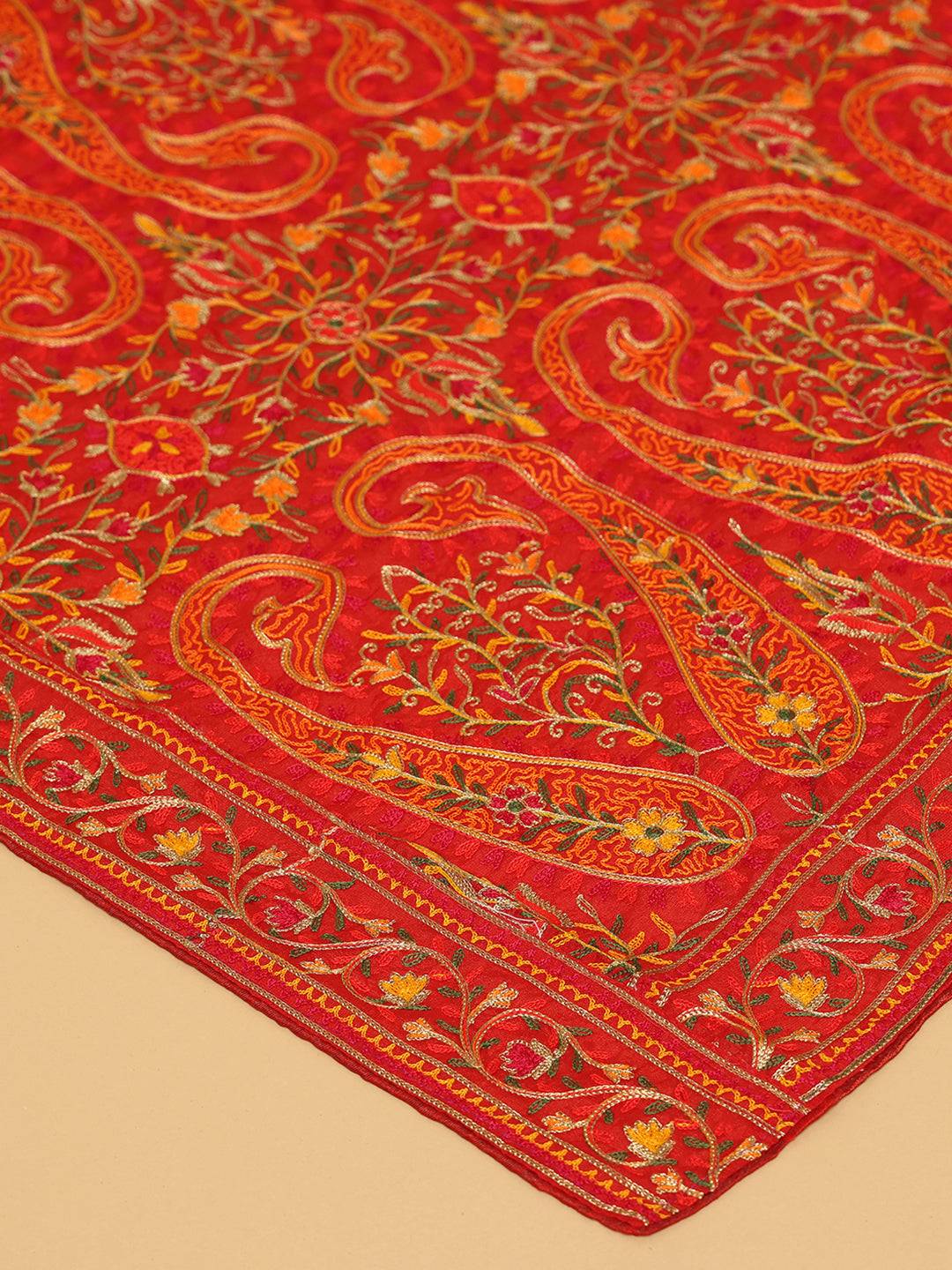 Close-up of detailed embroidery on red dupatta
