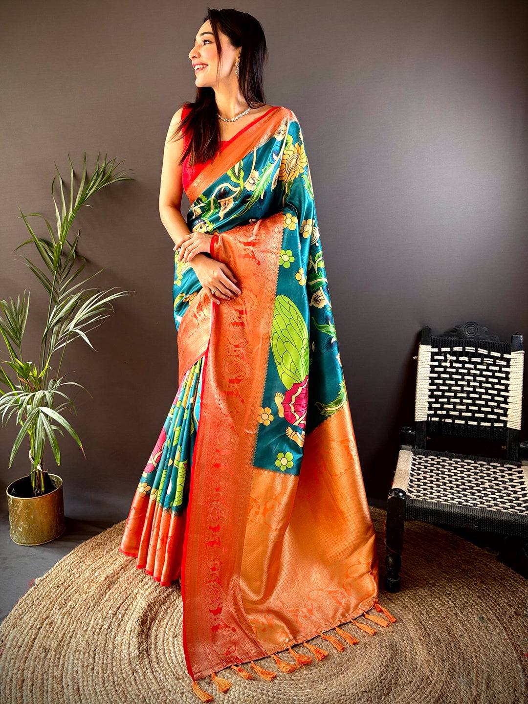 Elegant Pichwai Kalamkari print saree with vibrant colors and zari border.
