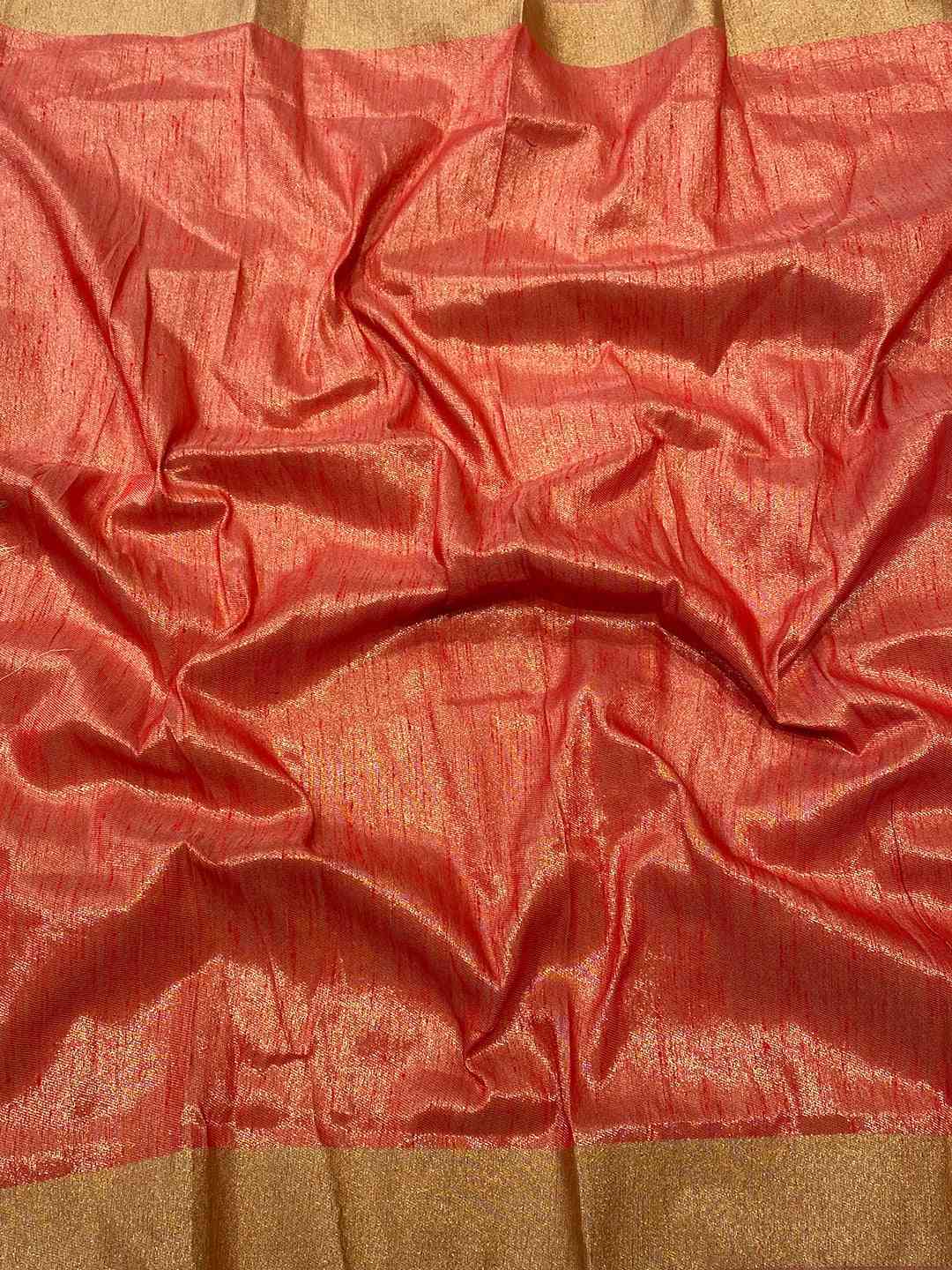 Detailed view of red and gold fabric of the Kalamkari Linen Saree.