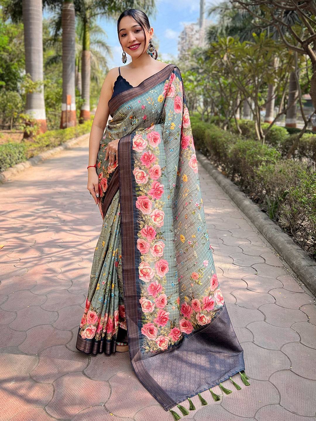 Teal silk saree with copper zari and floral print