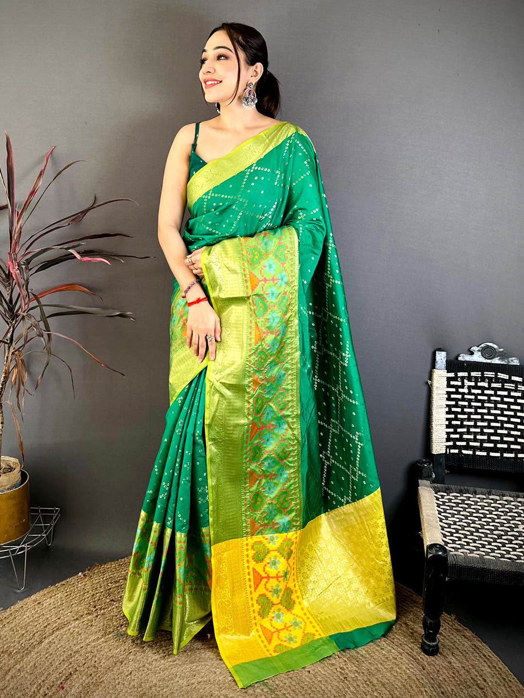 Green Katan Silk Ikkat Saree with vibrant border and detailed weaving