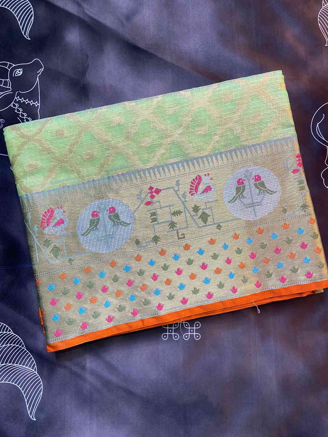 Folded green Kota Doria saree with Minakari and Patola motifs