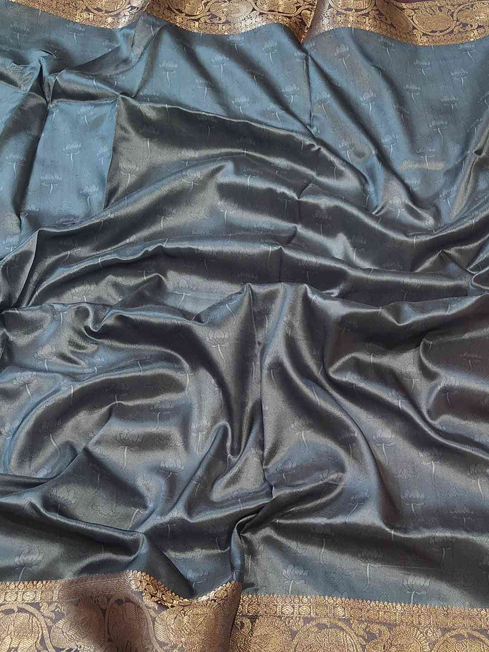 Soft silk saree fabric with intricate Kalamkari border