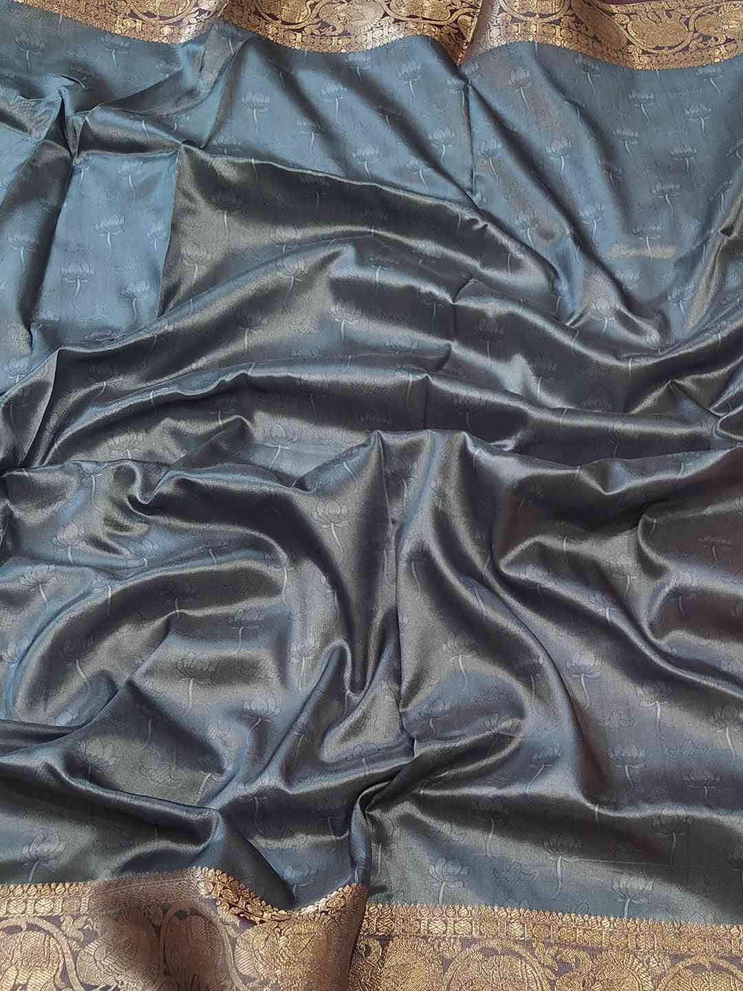 Soft silk saree fabric with intricate Kalamkari border