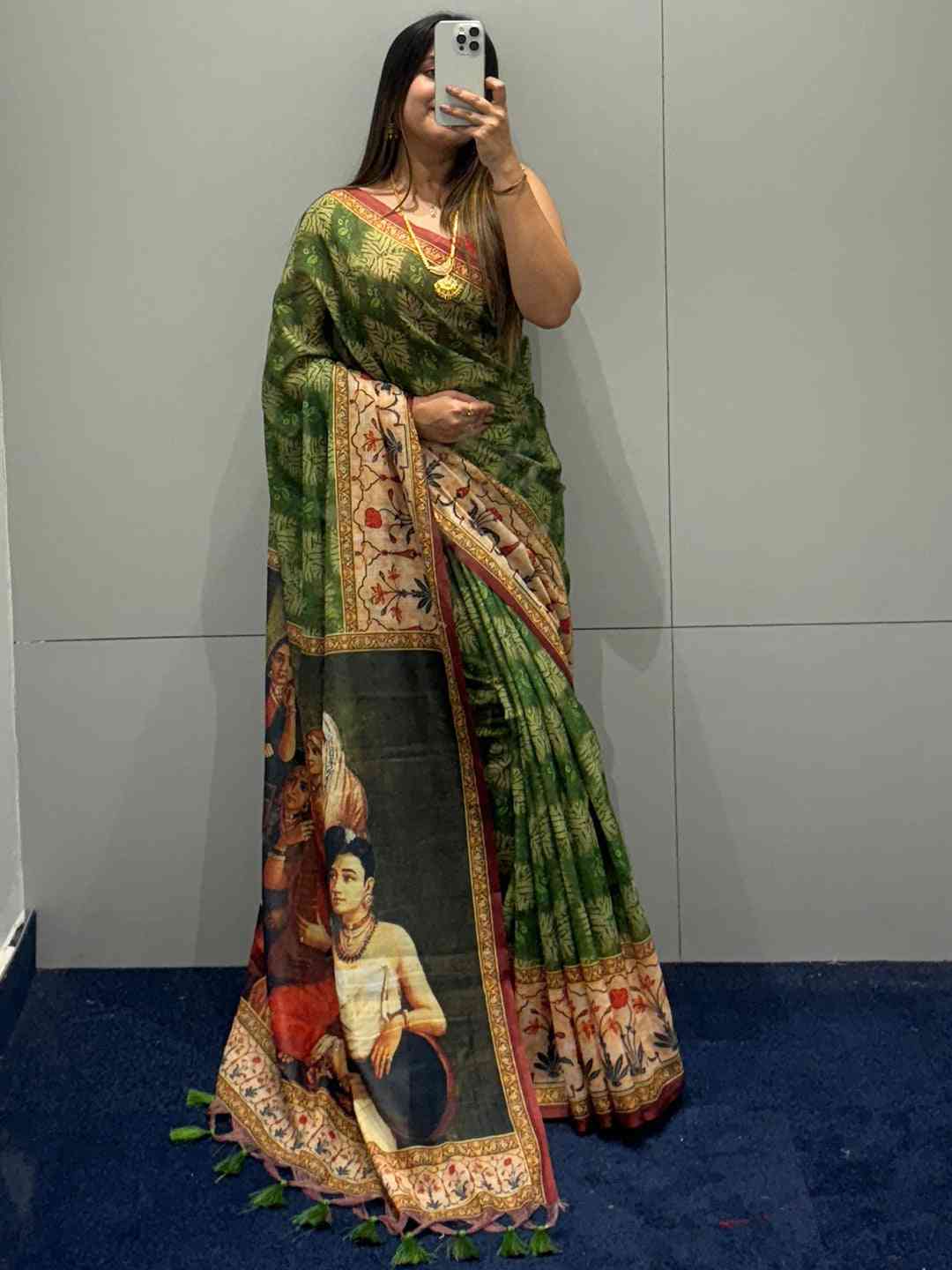 Standing model in green saree with kalamkari pallu