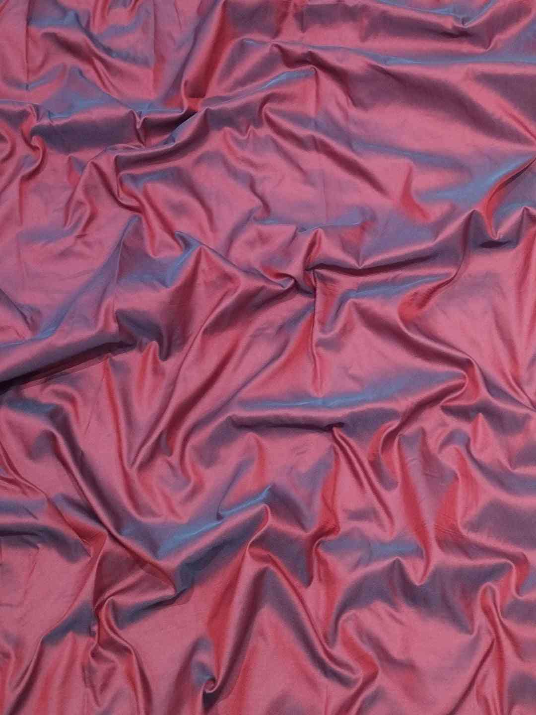 Close-up of lavender Paithani silk fabric texture