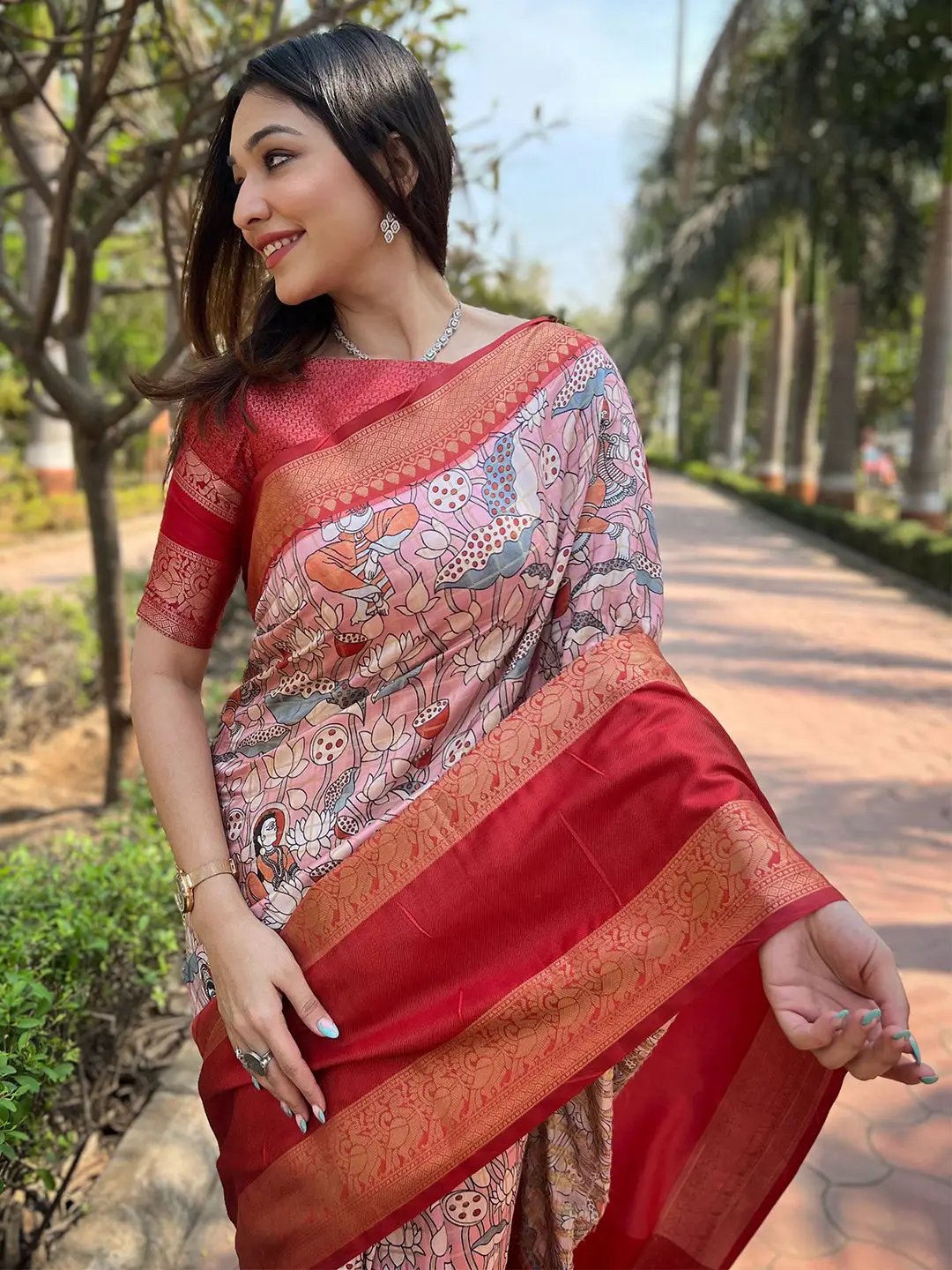 Close-up of pink Banarasi saree with floral patterns