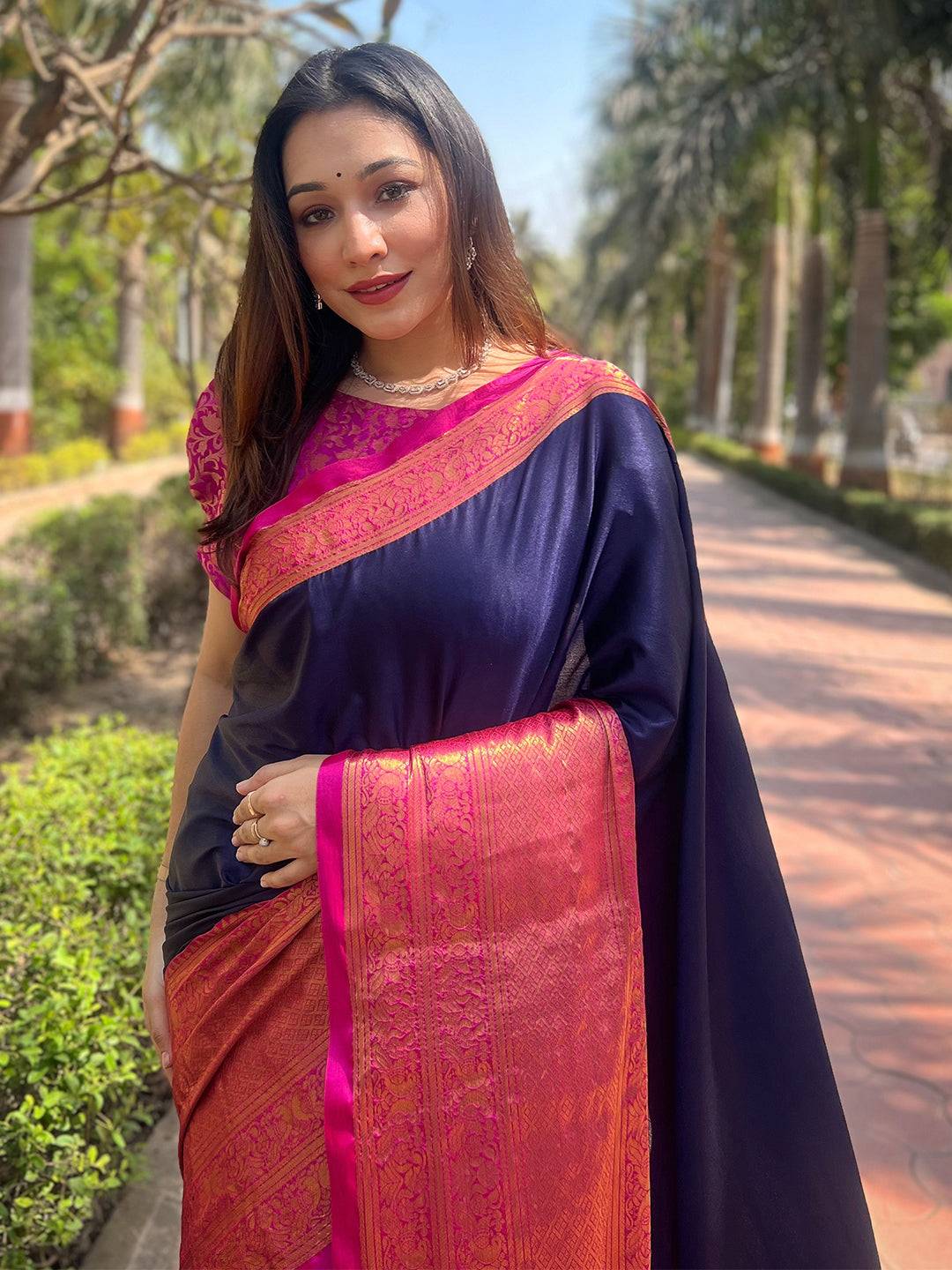 Aura Soft Silk Navy Saree with Kanjivaram Weaving, worn outdoors