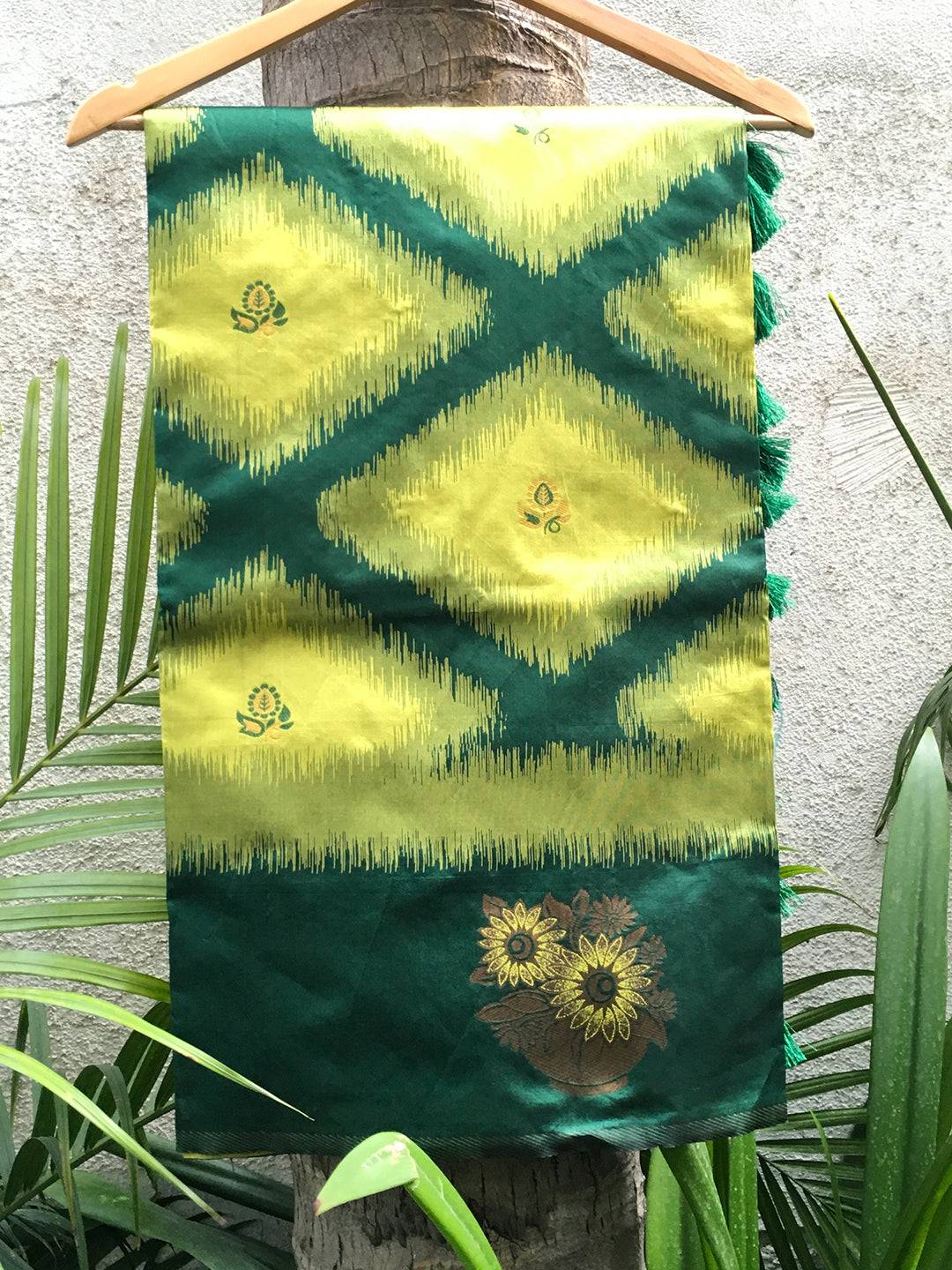 Green Tussar Silk Ikkat Weaving Saree draped on hanger