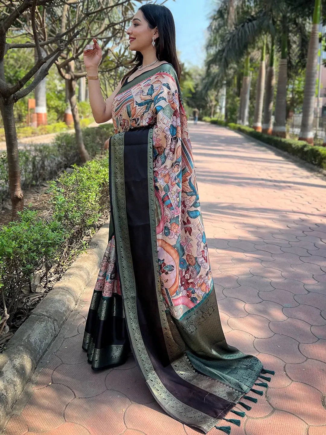 Traditional Banarasi saree featuring detailed artwork and green border