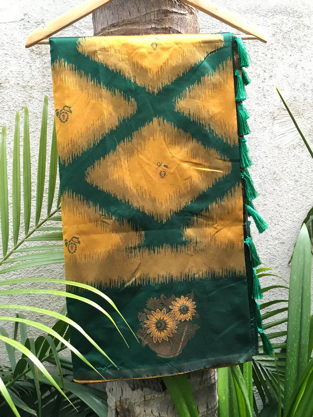 Mustard tussar silk saree with ikkat pattern on display