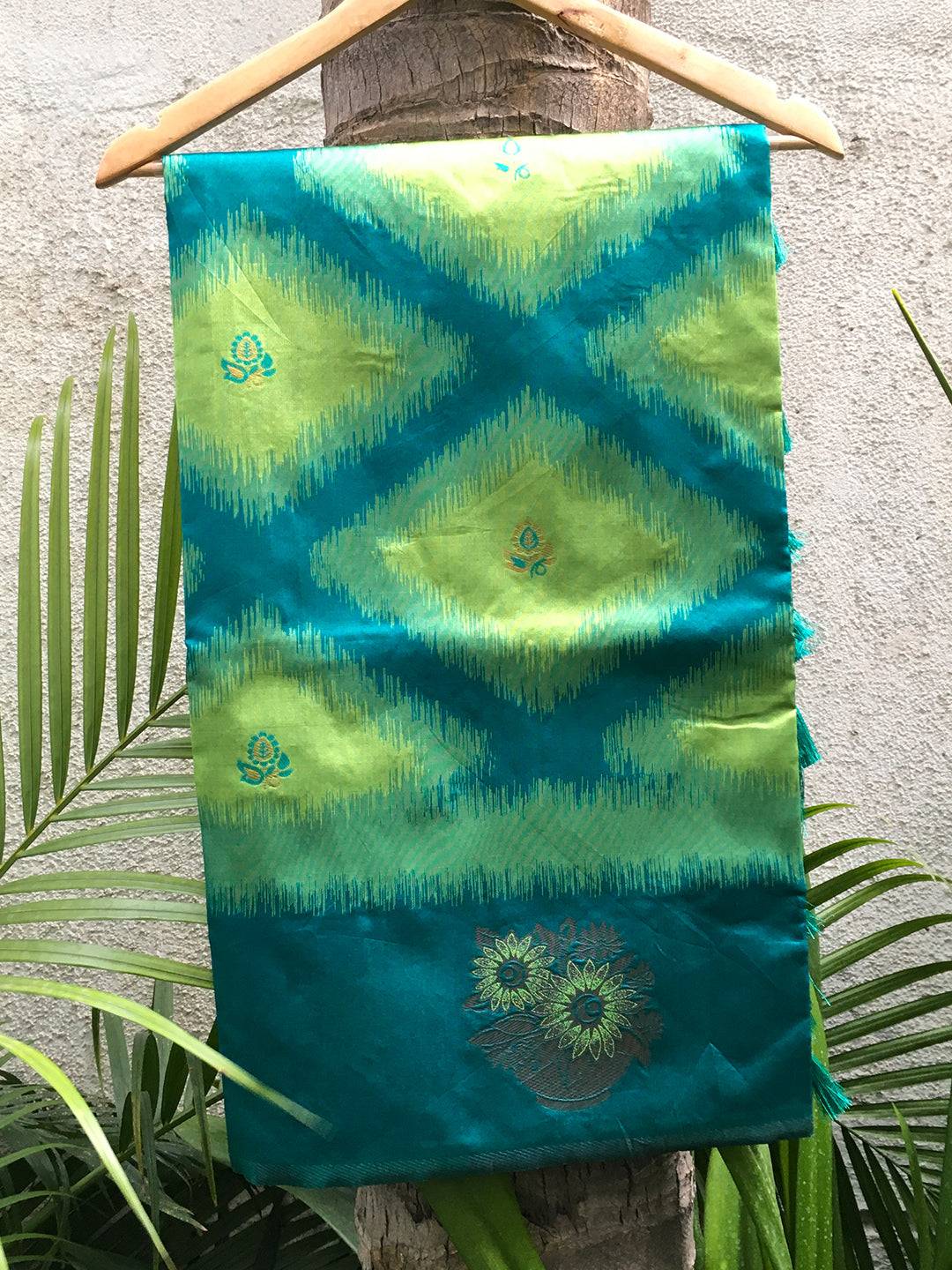 Parrot Green Tussar Silk Ikkat Weaving Saree on display.