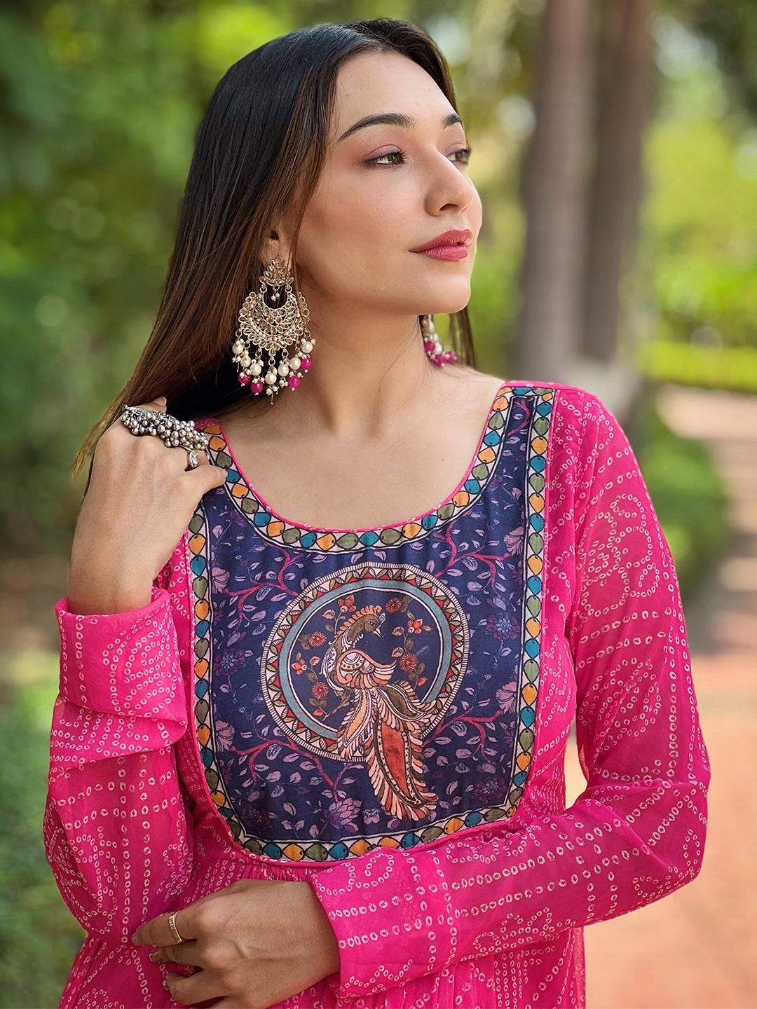 Close-up of deep pink dress with Pen Kalamkari Yog design.
