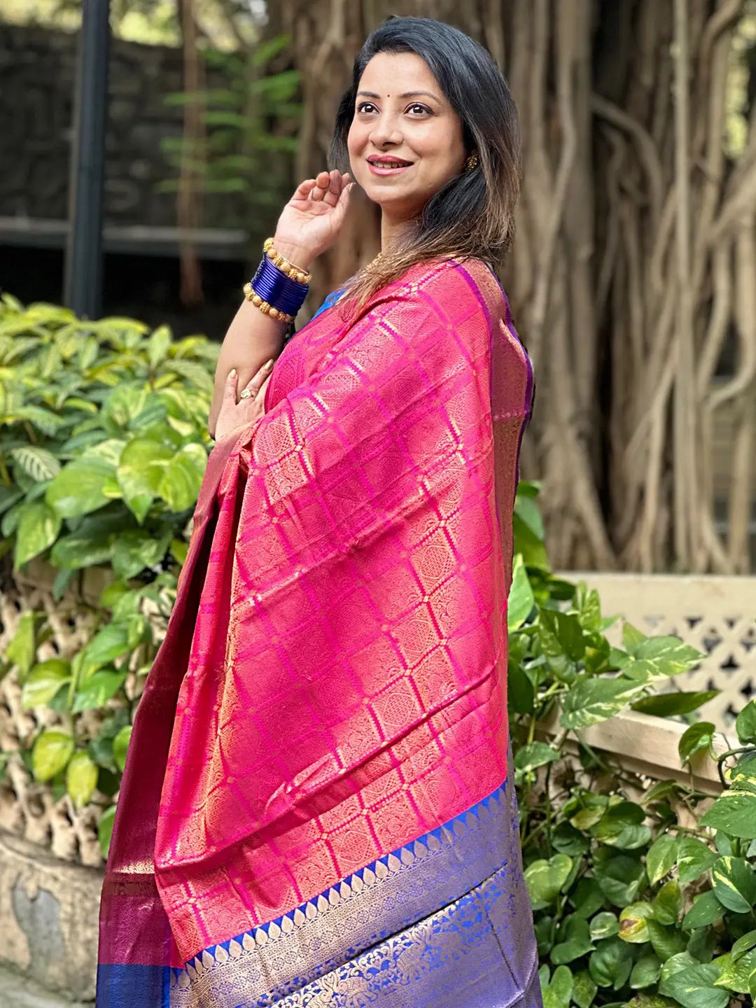 Side view of pink Kanjivaram saree with intricate zari