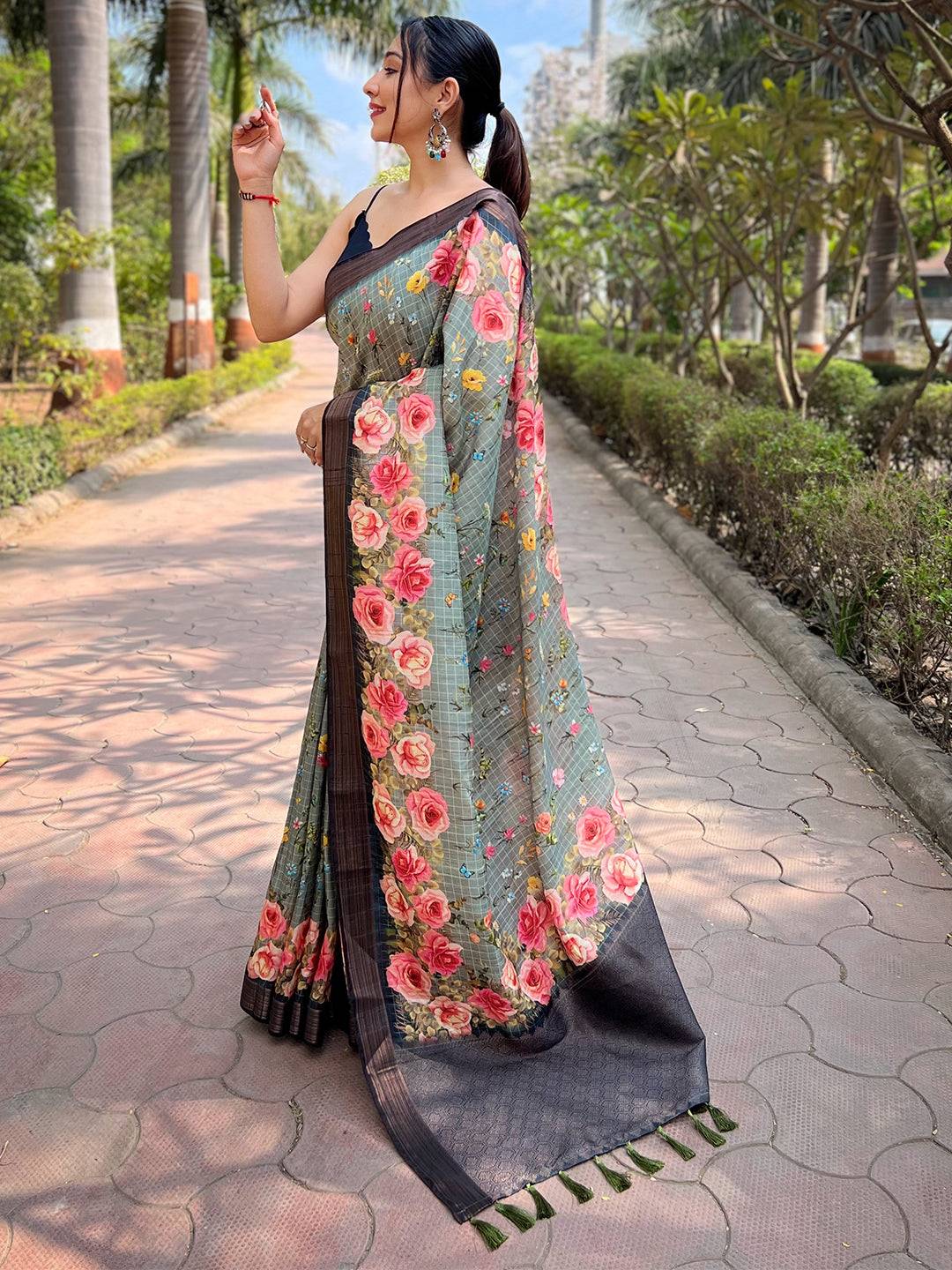 Teal silk saree with copper zari and floral print