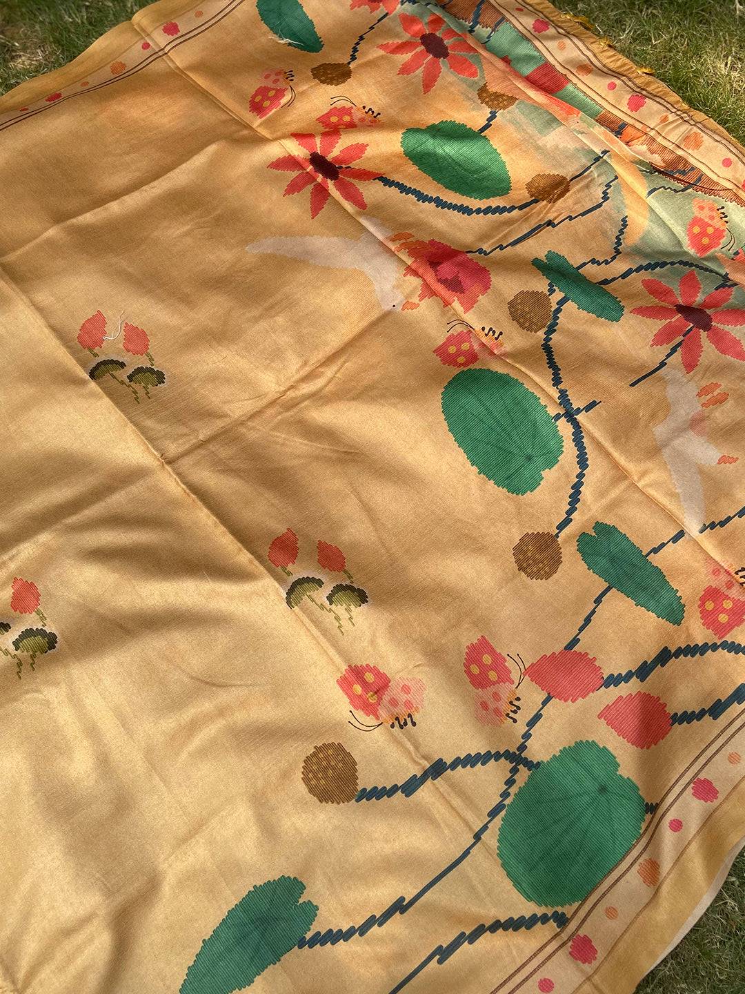 Spread of Gold Tussar Silk Saree with Vibrant Kalamkari Patterns