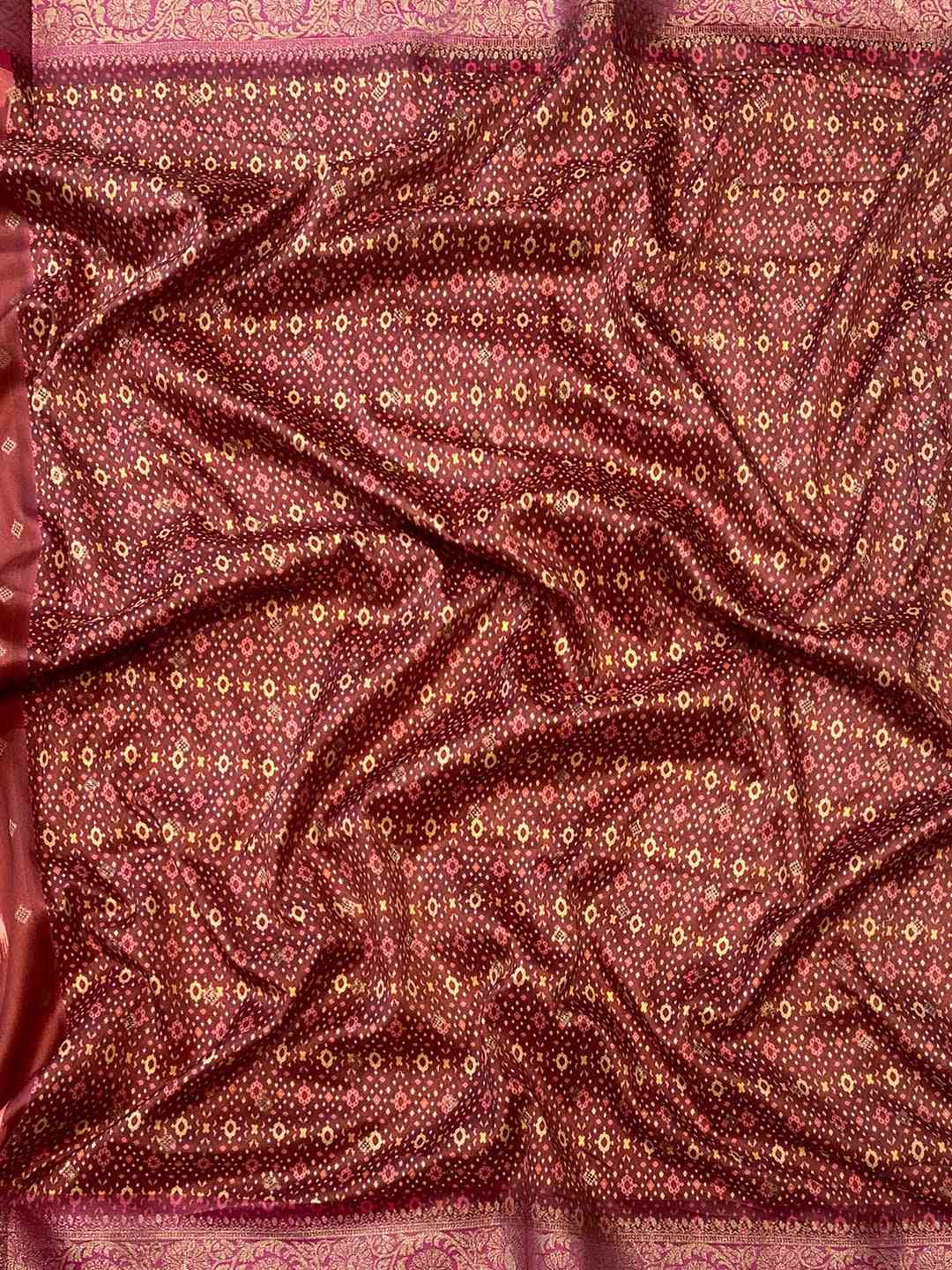 Detailed view of soft silk Banarasi saree with zari patola pallu.